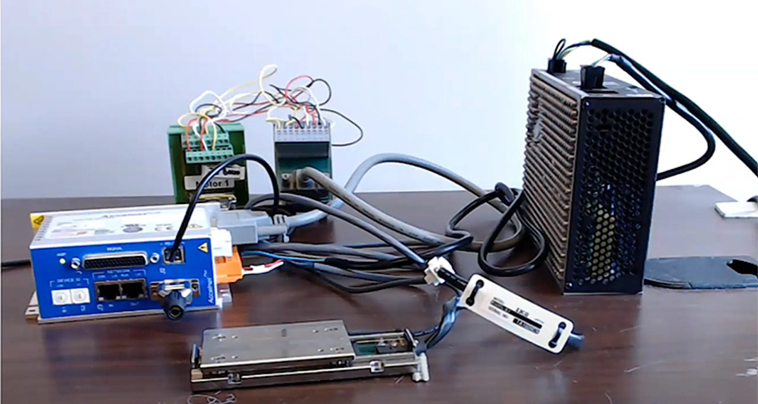 Figure 3. A demonstration consisting of an IKO NT-55-V-25/5L two-axis (X and Y) stage, an Accelnet Plus Panel digital servo drive with 250-microsecond position loop update rate, an 80V power supply and a USB to serial RS-232 adapter.